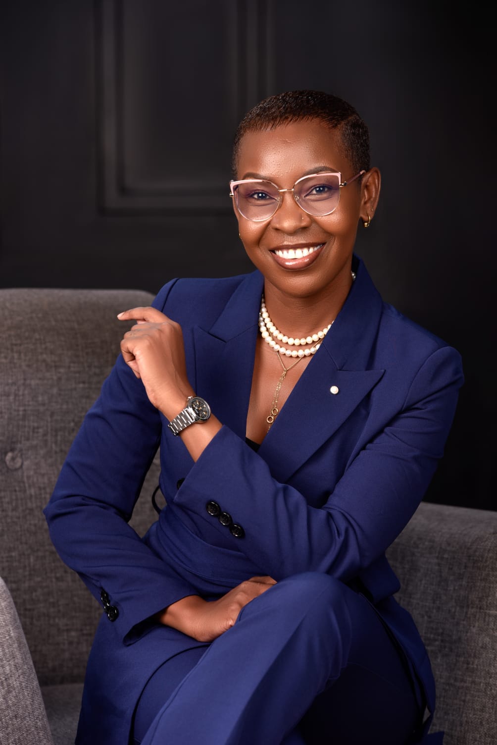 Eunice Ireri — Emerald suit — mustard bench